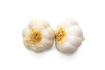 Raw garlic heads isolated on white background close-up