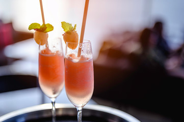 Fresh pink cocktail on serving.