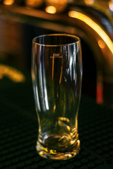 empty glass on dark wooden table