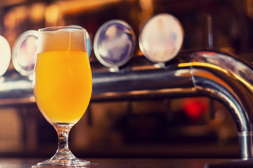 glass of beer on wooden table