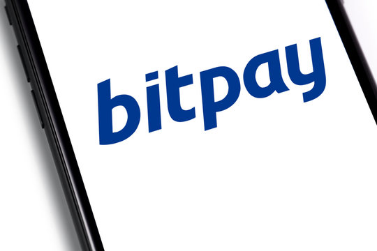 BitPay logo on the screen smartphone. BitPay is a Bitcoin payment service provider headquartered in Atlanta, GA, USA. Moscow, Russia - March 26, 2019