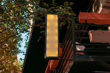 exterior view of a cafe with blurred back. sharpness on the front stone