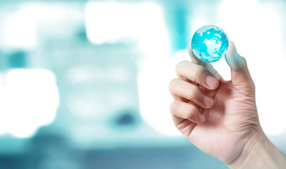 glass globe in hand