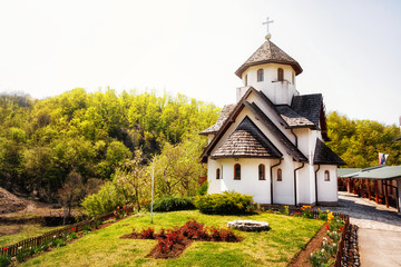 Christian orthodox church, surrounded with colorful forest.