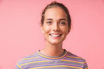 Image closeup of young beautiful woman dressed in colorful clothes smiling at camera with happy look