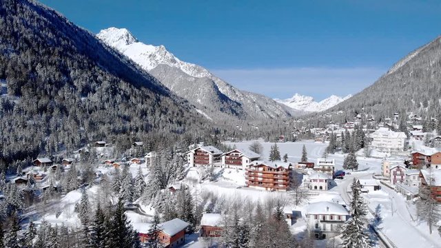 Champex-Lac Switzerland beautiful winter aerial panorama. Cinematic camera rising to discover the breathtaking view