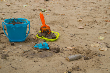 Children toys. The concept of travel and vacation. Many molds for sand, shovel, rake and baby bucket.
