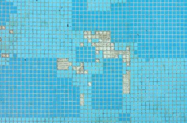 Abandoned swimming pool, in serious need of some maintenance