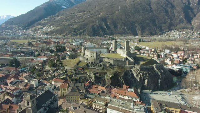 Castelgrande Castle. Bellinzona, Ticino, Switzerland. Swiss Alps. Aerial View. Drone Flies Forward Tilt Up Wide Shot