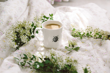 A cup of coffee with flowers