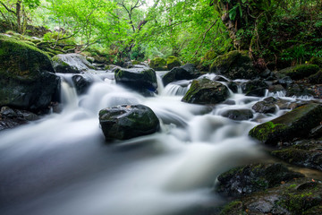 Waterfall running through Lake District, Northern England, UK