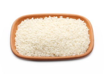 Glazed rice pile in clay bowl, plate isolated on white background
