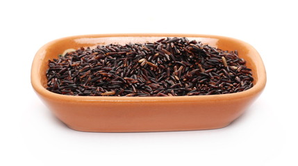Black rice in clay pot, bowl isolated on white background