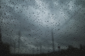 raindrops on the glass, on a gray background.