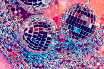 disco ball bauble on pink background.  party concept