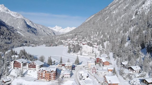 4K Champex-Lac Switzerland winter aerial shot. Scenic landscape on a sunny day with fresh snow