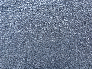 Texture of blue wallpaper with a pattern. Silver paper surface, structure closeup.