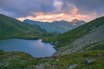 Summer mountain lake at sunset