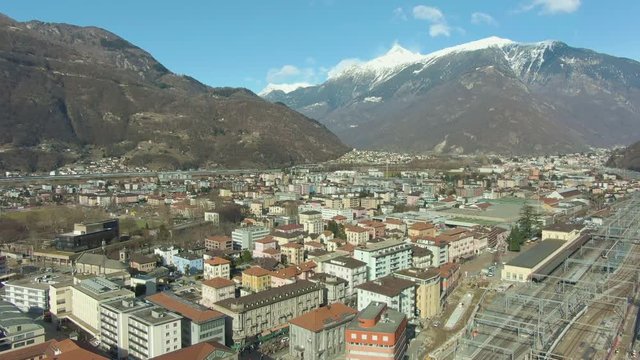 Bellinzona Cityscape, Ticino, Switzerland. Aerial View. Swiss Alps. Drone Flies Forward Wide Shot