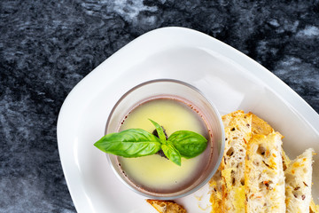 Close up view on chicken pate with crouton. Traditional french cuisine. Tasty appetizers or snack before lunch. Top view, flay lay food on marble table