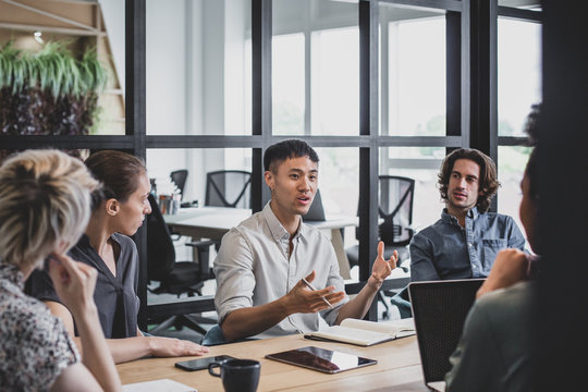 Asian businessman speaking in a meeting