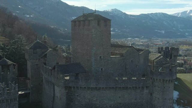 Montebello Castle. Bellinzona, Ticino, Switzerland. Swiss Alps. Aerial View. Drone Flies Upwards Tilt Down Medium Shot