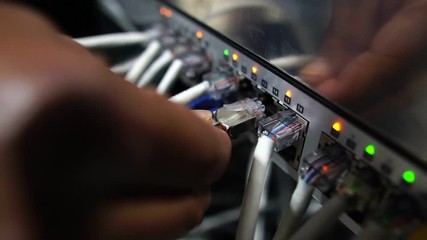 Computer engineers are repairing a network hub switch footage slow motion