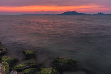 Sunset at Balaton Lake with sleeping vulcanos in the background