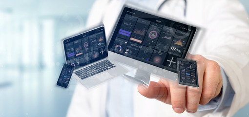 Doctor holding Devices connected to a cloud multimedia network 3d rendering