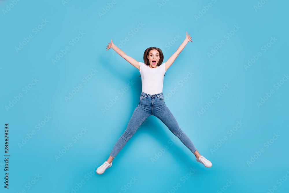 Sticker full size photo of cheerful youth raising hands shouting wearing white t-shirt denim jeans isolated 