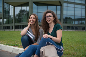 Two college students studying outside