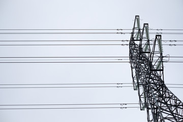 High voltage power line. View from the bottom up. Industrial infrasrtucture detail