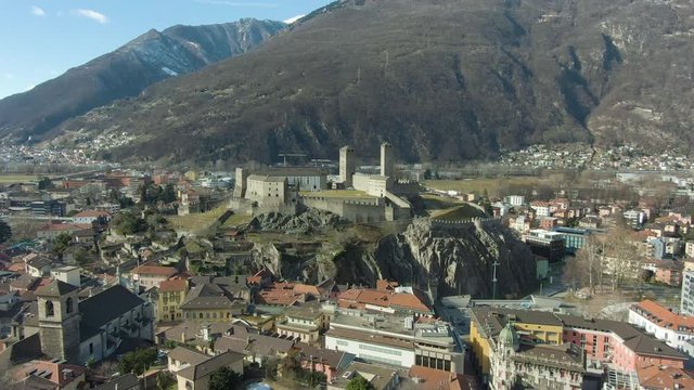 Castelgrande Castle. Bellinzona, Ticino, Switzerland. Aerial View. Drone Flies Forward over Montebello Wall. Wide Shot