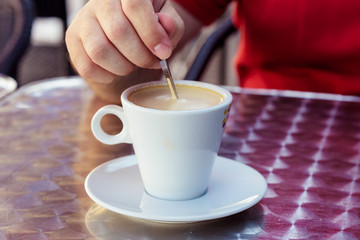 Closeup image of a businessman`s hands with coffee