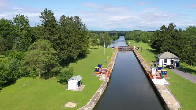 Aerial Erie Canal lock 29 Palmyra New York fast. Pioneer engineering wonder. 363 miles long man made waterway built in 1817. Transport of cargo from eastern ports and cities.