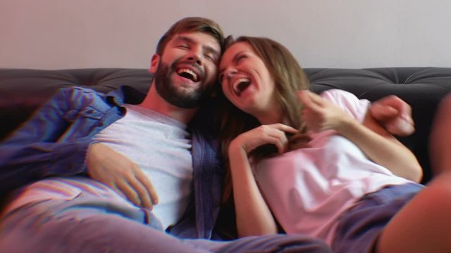 Intoxicated girlfriend and boyfriend laughing together, drugs mental effect