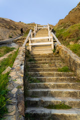 wooden and stone stairs on Barrika beach in Biscay