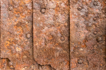 Old rusty metal plates texture with rivets