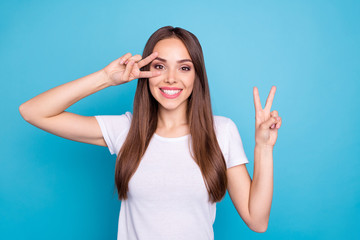 Fototapeta premium Portrait of her she nice-looking attractive lovely cheerful cheery funny straight-haired lady showing double v-sign event holiday isolated over bright vivid shine blue green teal turquoise background