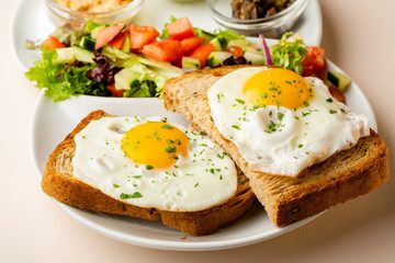 Fried eggs on toasted bread