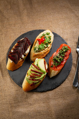 Set of crostini with meat and  vegetables