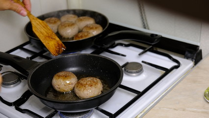 pork cutlets fried in a pan
