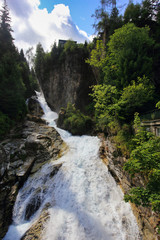 Fototapeta na wymiar waterfall bad gastein in the centre of spy town, austrian alps