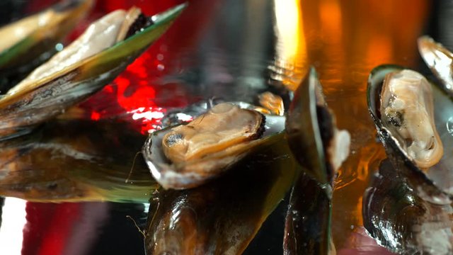 Mussels in drops of water slowly fall on a table with water,SLOW MOTION,4k, phantom
