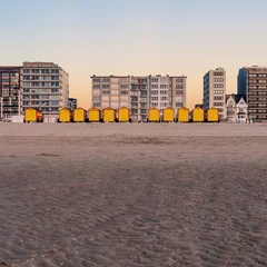 Gordijnen Vintage beach huts on the Belgian coast at sunset © Erik_AJV