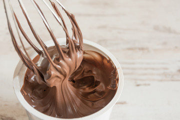 Chocolate cream dessert swirling in a white plate.