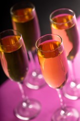 Four Champagne Glasses on Black Background