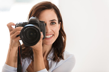 Fototapeta premium Close up of a beautiful smiling woman photographer