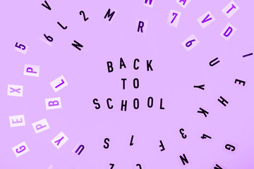 Back to school concept. Letters on purple background.