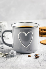 Christmas coffee in mug and gingerbread cookies with ornaments. Selective focus, copy space.